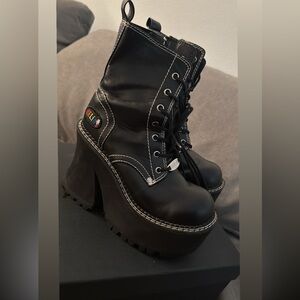 Delia’s Black Platform Boots with White Stitching